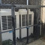 Air conditioning units in cage