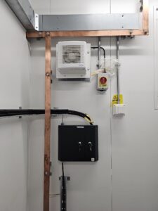 Fibre optic panel inside control room with organised patching and termination points