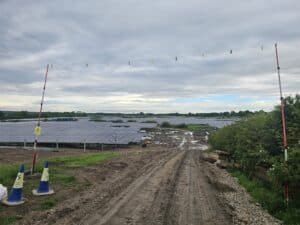 Solar farm infrastructure with panel arrays and external environment supporting fibre optic networking